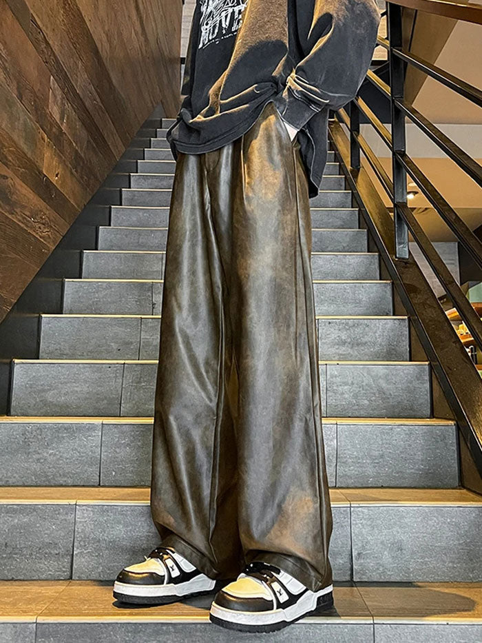 Side view of loose-fit faux leather cargo pants with elastic waistband.