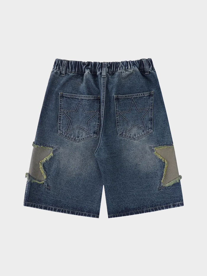 Rear view of denim shorts featuring stitched star designs on the back pockets