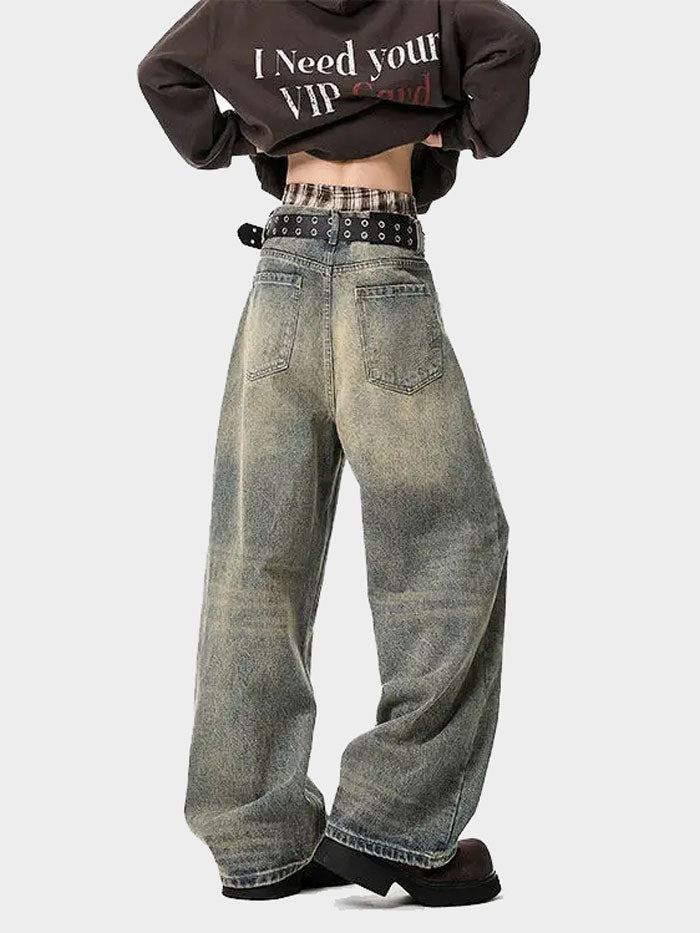 Back view of vintage washed wide-leg jeans showing rear pockets and distressed finish.