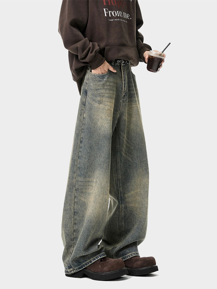 Wide-leg jeans with belt styled at front – vintage wash and streetwear aesthetic.