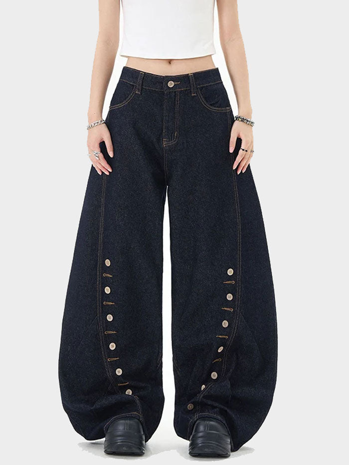 Front view of dark denim balloon-leg jeans with button details and high-waisted fit.