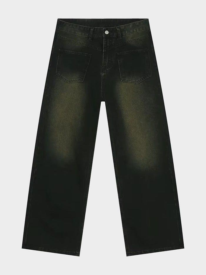 Flat lay of black vintage-style wide-leg jeans with yellowish faded wash and high waist.