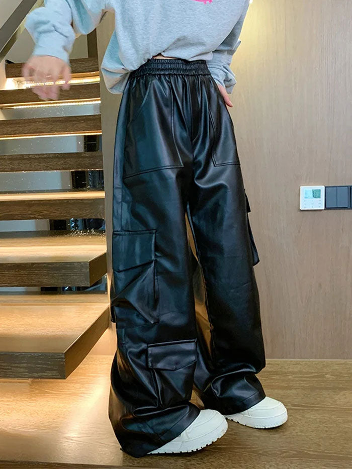 Front view of black faux leather wide-leg cargo pants with side pockets.