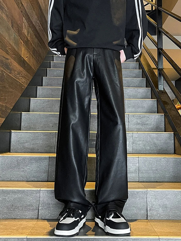 Front view of black faux leather wide-leg cargo pants for men.