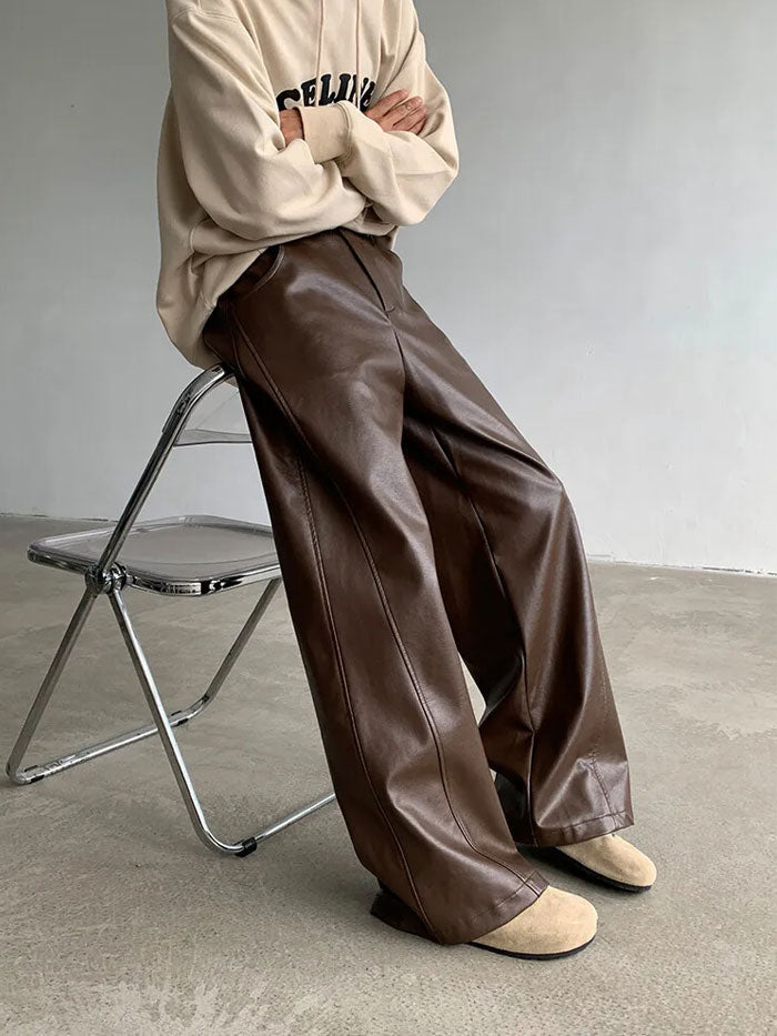 Loose fit brown leather pants styled with Celine Paris hoodie.