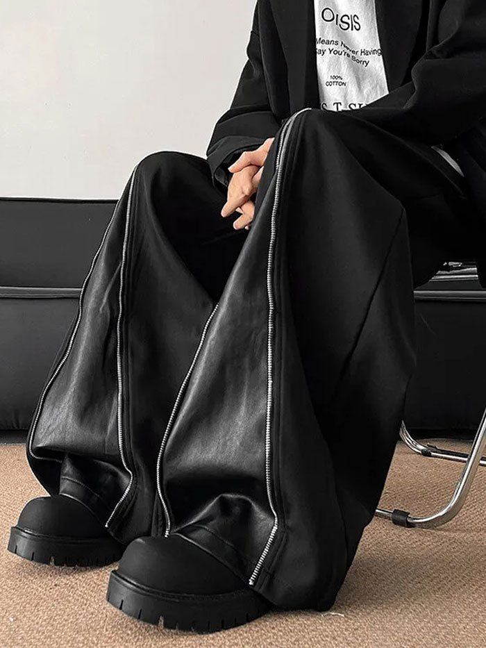 Rear image of black baggy pants with dual leather back pockets.