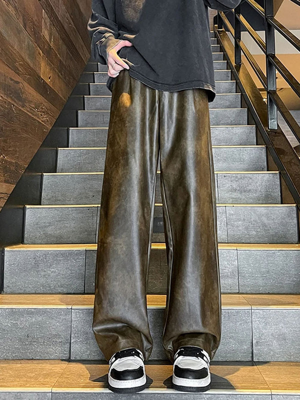 Streetwear style black leather cargo trousers for men with multiple pockets.