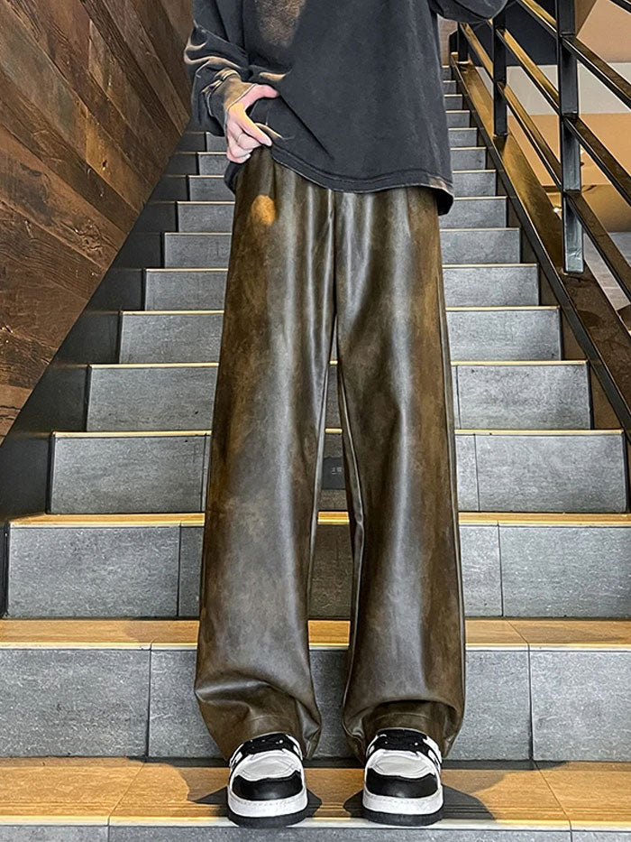 Streetwear style black leather cargo trousers for men with multiple pockets.