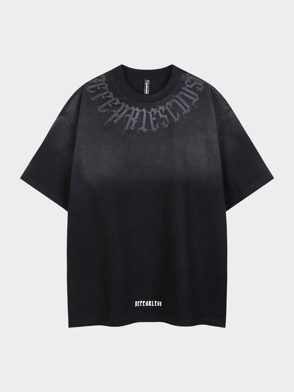 Black front view of oversized ombré t-shirt featuring gothic neck lettering and "Be Fearless" hem text