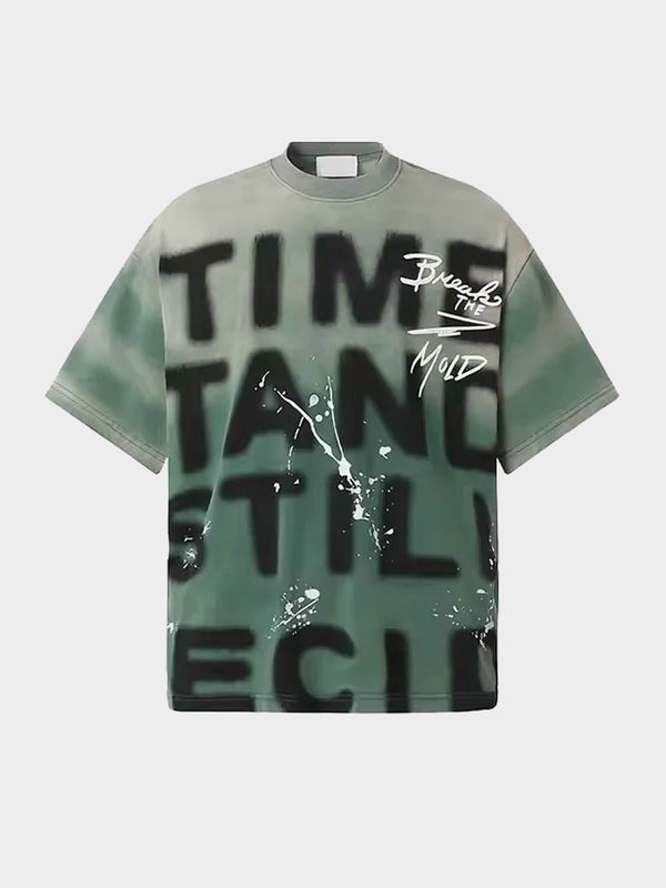 Green streetwear T-shirt front with graffiti-style text and paint splatter graphics
