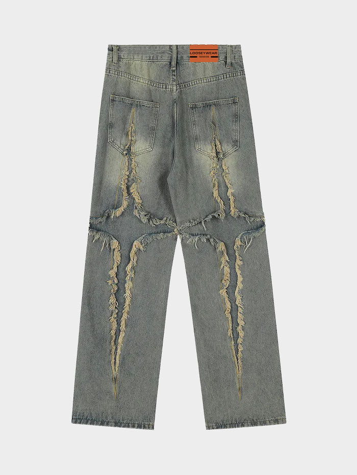 Washed oversized jeans with extreme fringe detailing and relaxed fit.