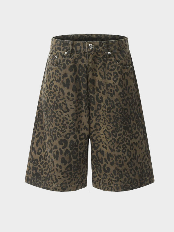 Front view of wide-leg leopard print denim shorts with button closure.