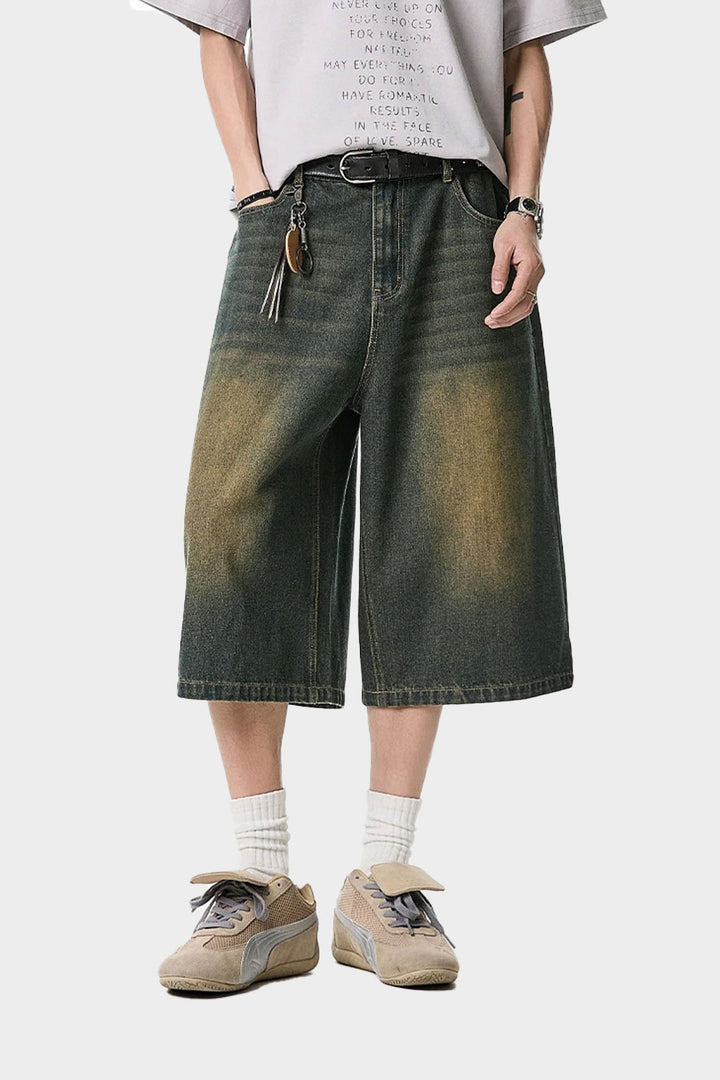 Waist fit waistband visible under washed denim shorts