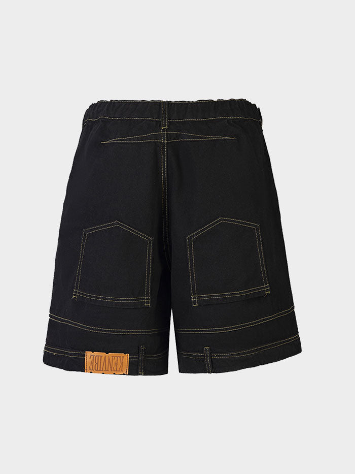 Back view of black denim shorts with contrast stitching and KenVibe patch.
