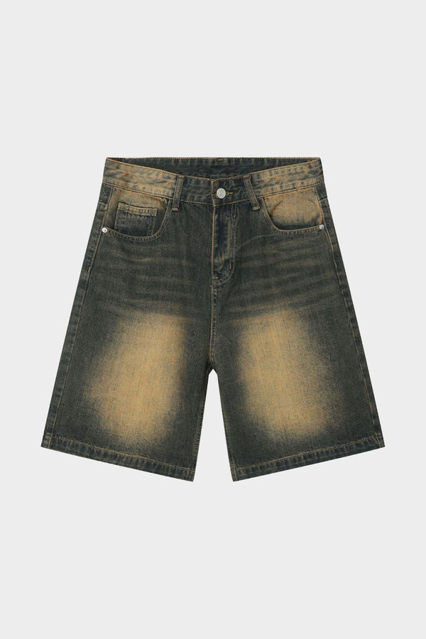 Flat lay of Looseywear denim shorts in black with yellow washed treatment