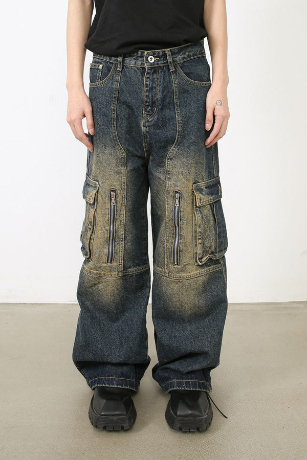 Front view of vintage washed wide-leg cargo denim jeans with zipper pockets