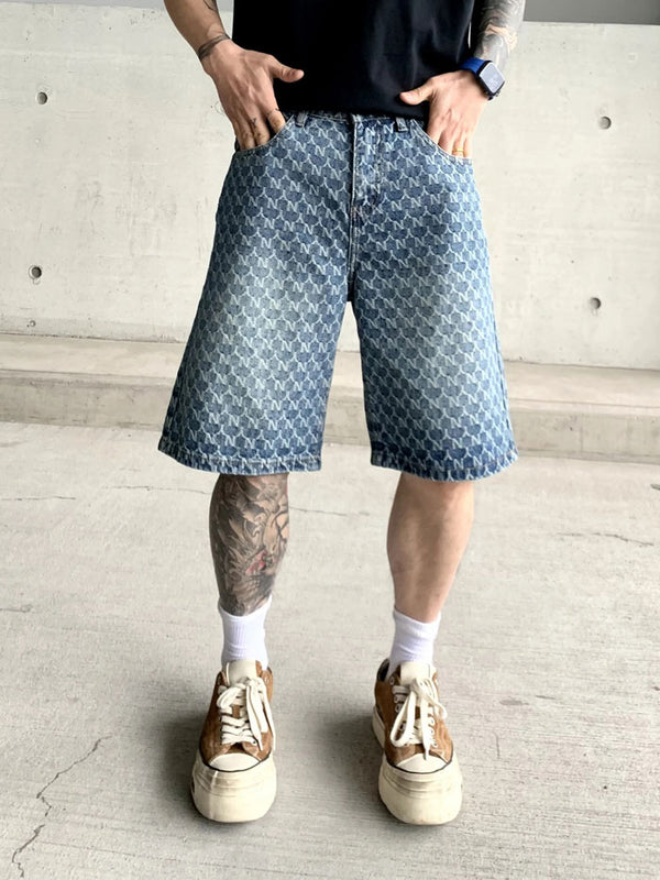 Streetwear style loose monogram denim shorts for men in outdoor setting