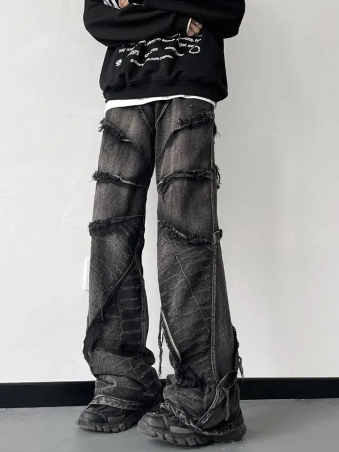 Full-body shot of man wearing ultra baggy patchwork jeans styled with casual sneakers.