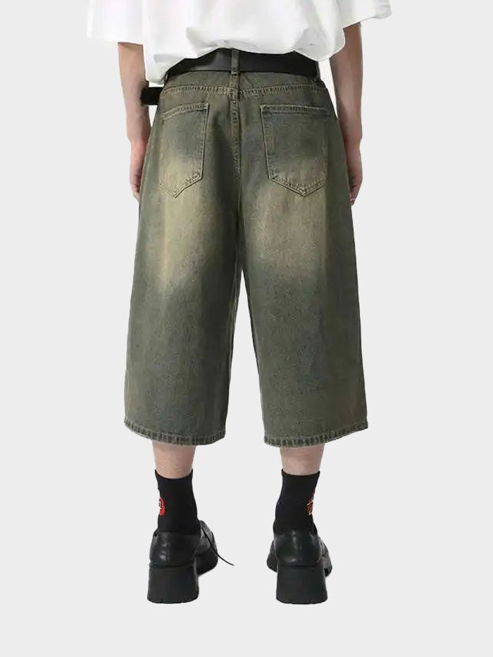Rear view of vintage olive denim shorts with classic pocket design
