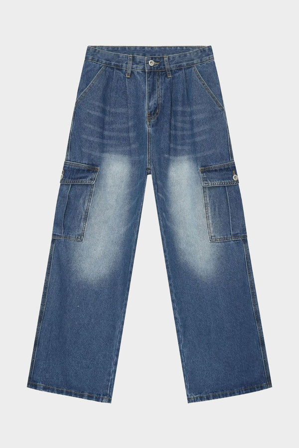 Close-up of oversized cargo jeans showing fabric fade and stitching details
