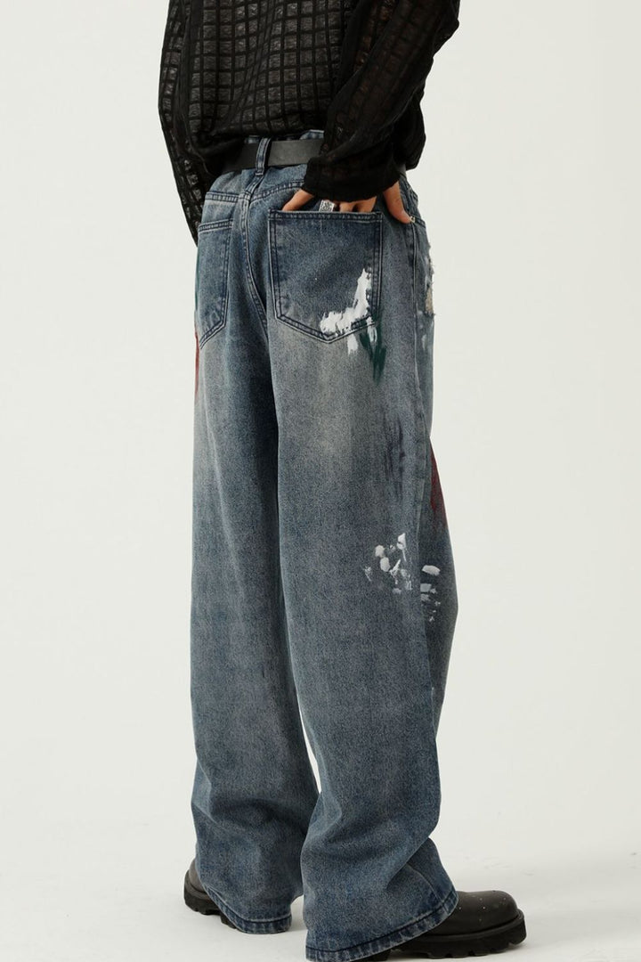 Rear view of wide-leg jeans showing back pockets and painted fade