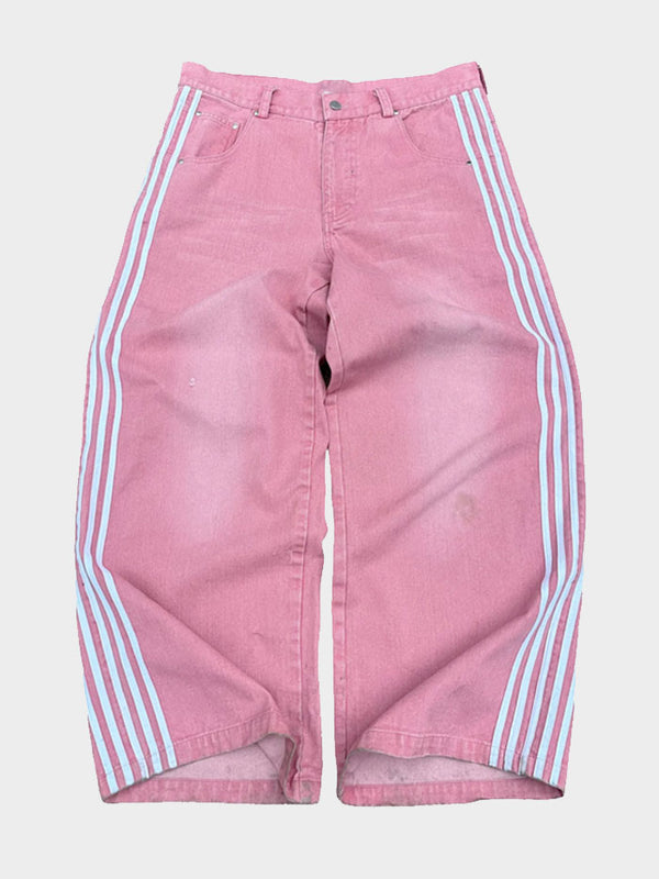 Front view of pink wide-leg jeans with white side stripes, displayed flat on a white background.