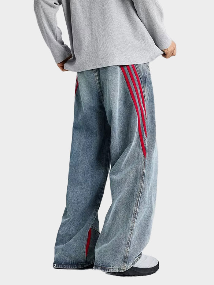 Rear view of unisex wide-leg denim pants with red stripe accents running down the back side.