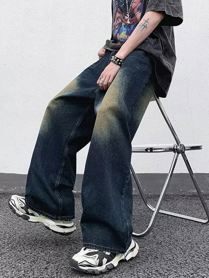 Man wearing retro baggy jeans with faded wash styling in an urban setting