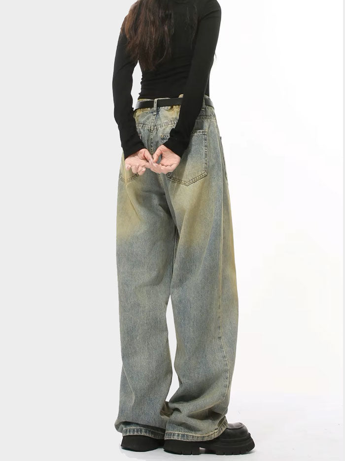 Back view of wide-leg jeans showing the high-waisted fit and vintage wash finish.