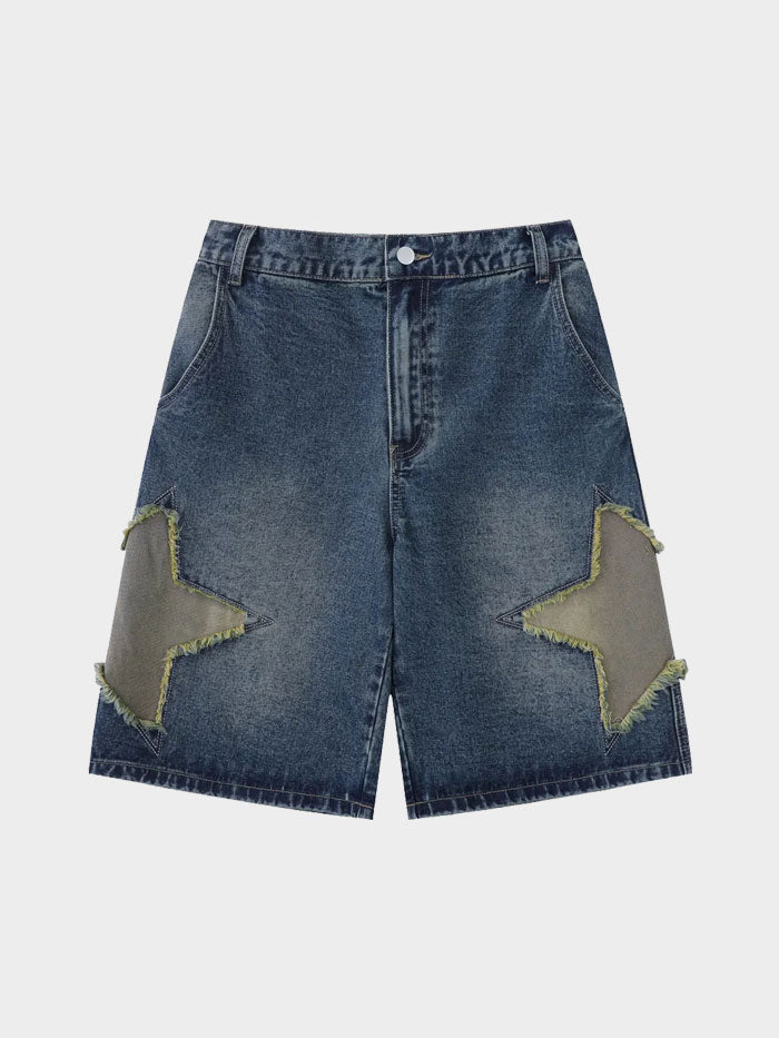 Close-up view of star patch frayed denim shorts with front button and deep wash texture