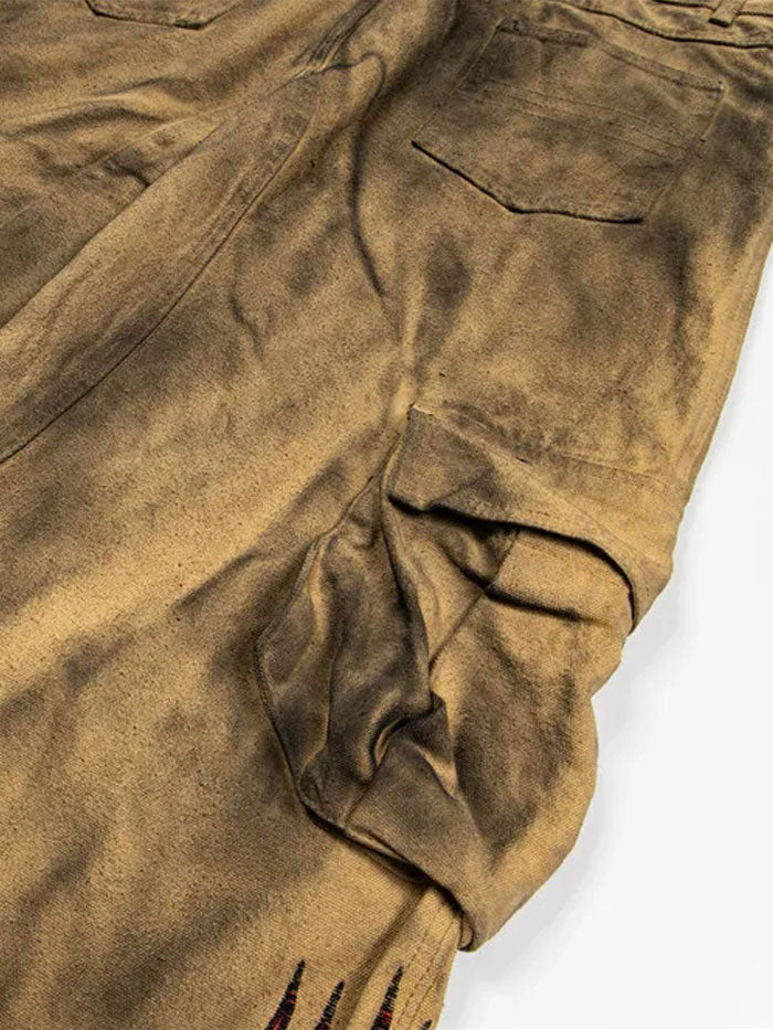 Detail of back pockets on stonewashed retro cargo pants.