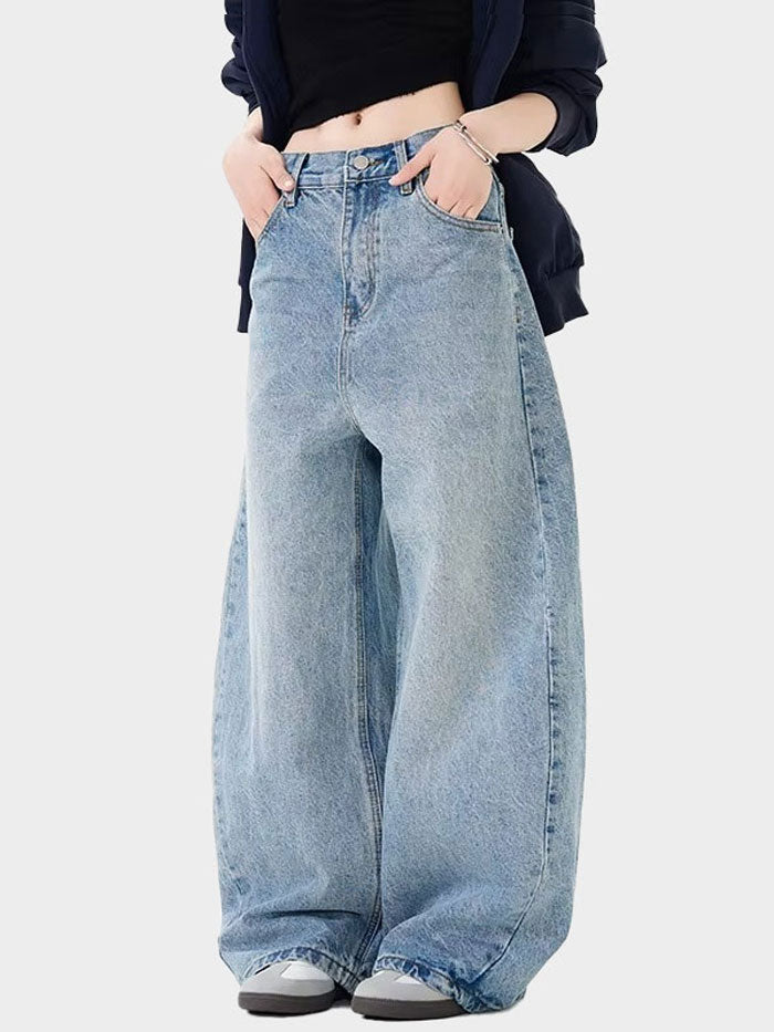 Trendy high-waisted vintage-washed denim jeans with extra wide legs, perfect for a casual look.