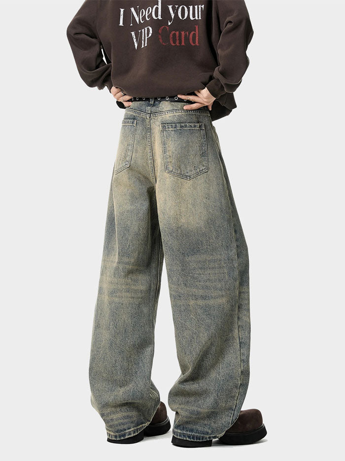 Relaxed wide-leg jeans styled with hands in pockets – washed denim in fashion shoot.