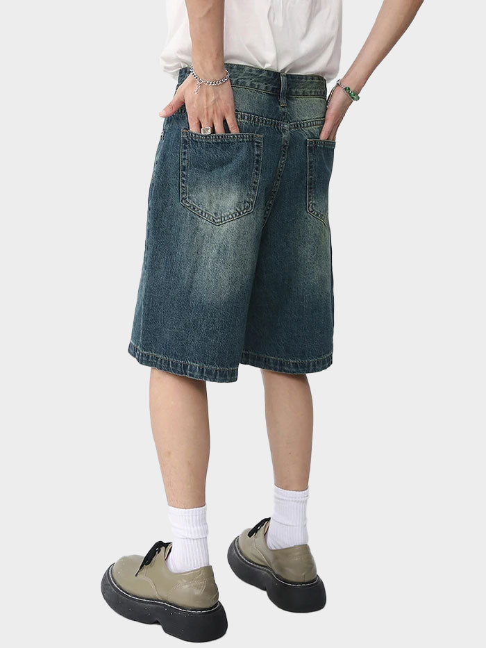 Back view of vintage-washed denim shorts showing rear pockets and worn-in look.
