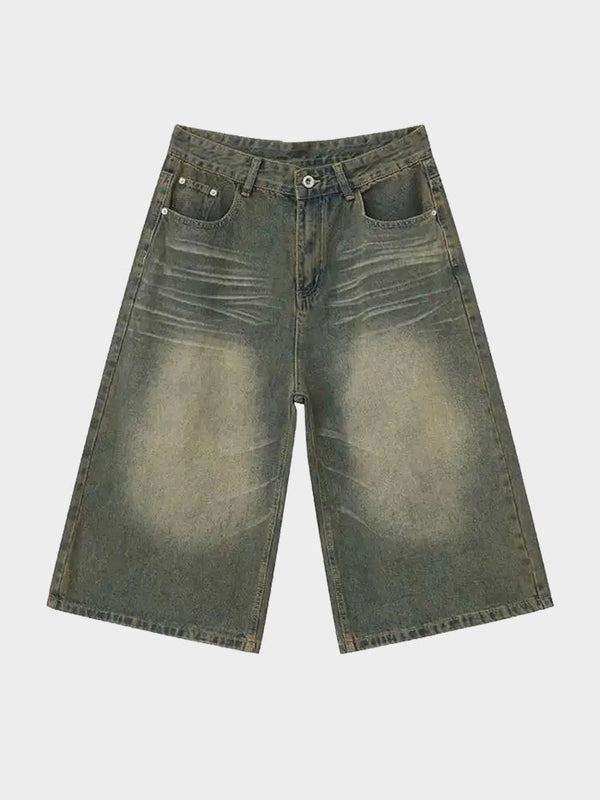 Olive green baggy denim shorts with vintage faded detailing, front view