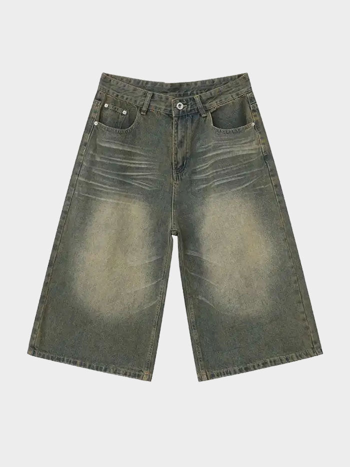 Olive green baggy denim shorts with vintage faded detailing, front view