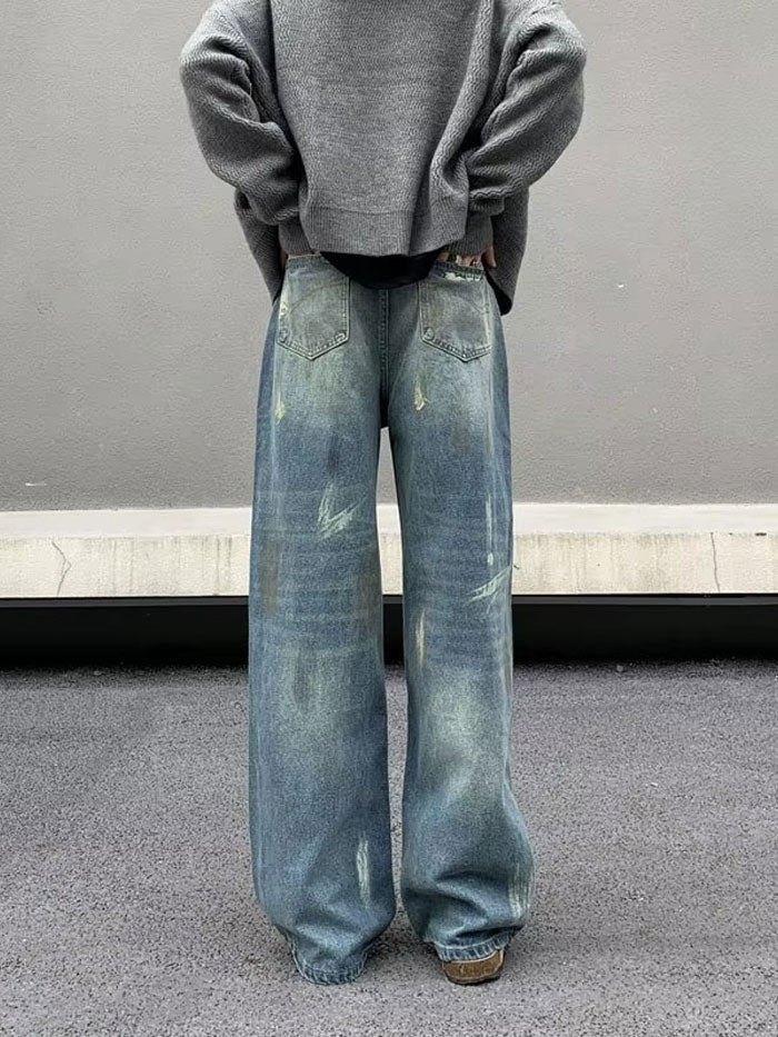 Back view of high-waisted vintage denim jeans with oversized fit.