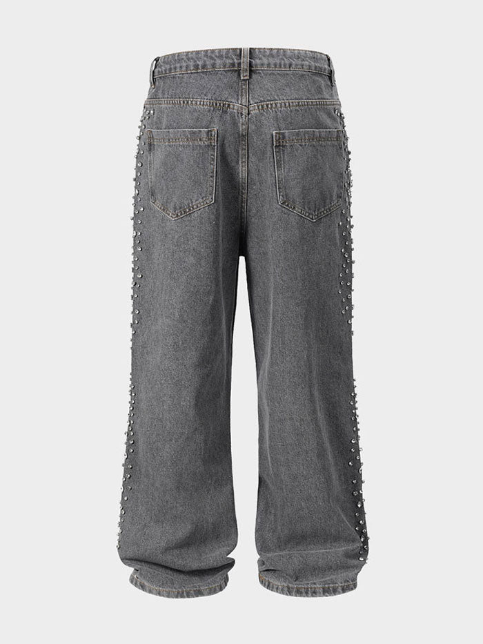 Front view of dark wash wide-leg jeans with shimmering pearl embellishments.