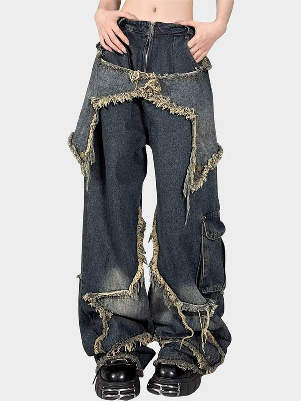 Model wearing Y2K-inspired grunge denim pants with star-shaped distressed patches and a wide-leg fit.